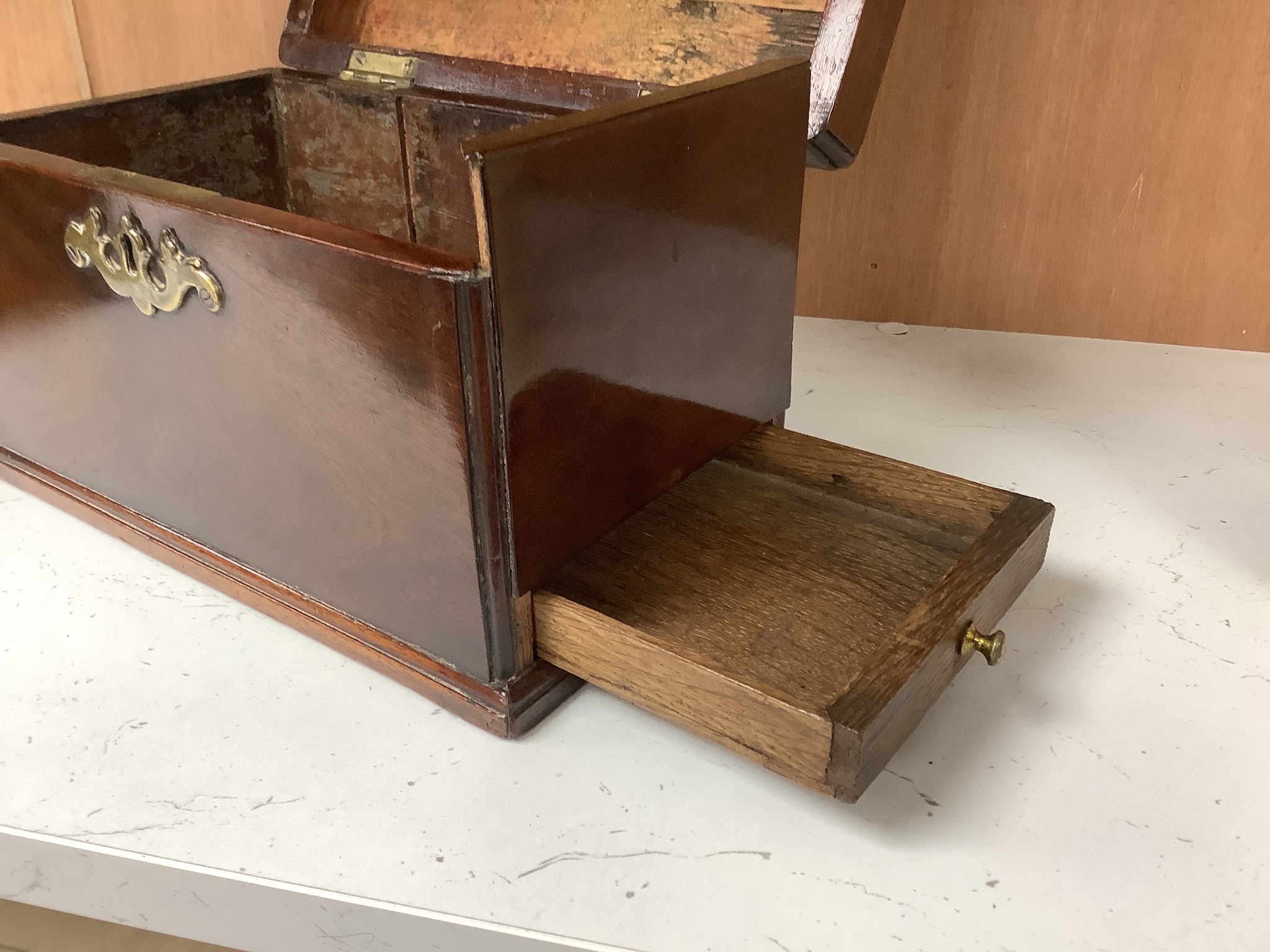 A George III mahogany tea caddy, with a concealed drawer to one end, width 22cm height 14cm